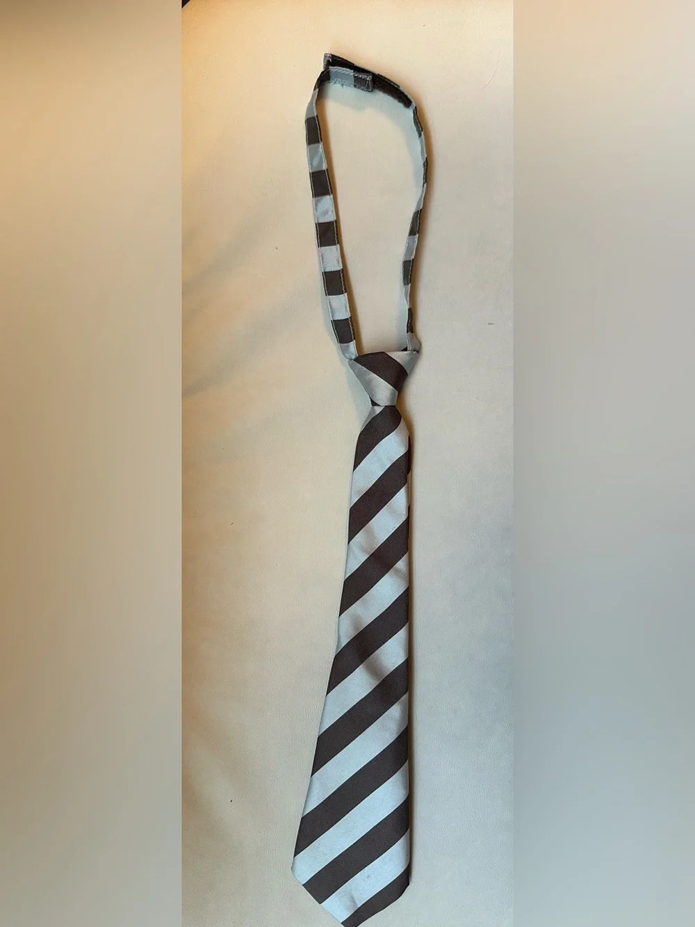 Striped brown and blue kids tie with Velcro closure
